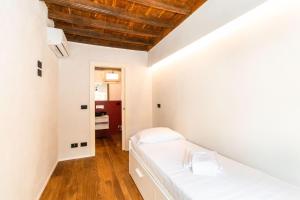 Posteľ alebo postele v izbe v ubytovaní Stylish Quardilatero Romano Central Flat