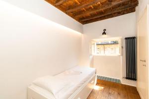 Posteľ alebo postele v izbe v ubytovaní Stylish Quardilatero Romano Central Flat