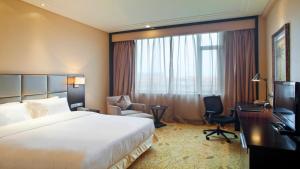 Postel nebo postele na pokoji v ubytování Holiday Inn Mudanjiang by IHG