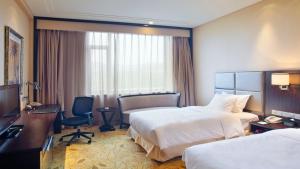 Postel nebo postele na pokoji v ubytování Holiday Inn Mudanjiang by IHG