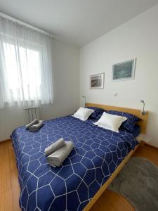 Posteľ alebo postele v izbe v ubytovaní LIPA Apartment