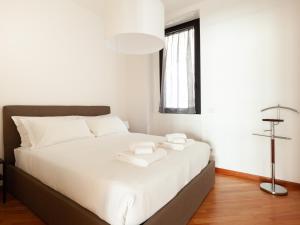 Posteľ alebo postele v izbe v ubytovaní easyhomes-Madonnina View
