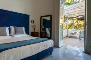 Posteľ alebo postele v izbe v ubytovaní Villa Manning Relais