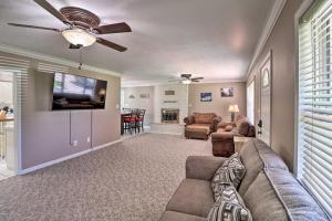 a living room with a couch and a flat screen tv at Robinson Roost Retreat Less Than 2 Mi to Norfork Lake in Mountain Home