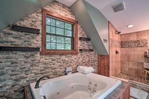 a large bathroom with a tub and a window at Yellow Mountain Blairsville Cabin with Scenic Deck in Hood