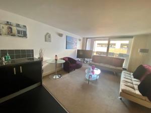 a living room with a couch and a table at Epworth Street in Liverpool