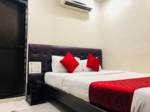 Postel nebo postele na pokoji v ubytování Hotel Guestinn Residency