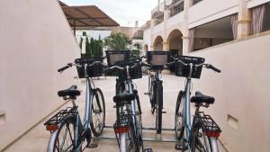 a group of bikes parked next to a building at Ynaira hotel & Spa in Ariany