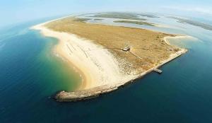 an aerial view of an island in the ocean at AP Eva Senses in Faro