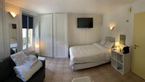 Letto o letti in una camera di Residence Vue Chateau