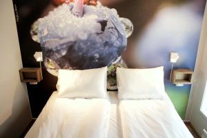 Letto o letti in una camera di Lillehammer Stasjonen Hotel