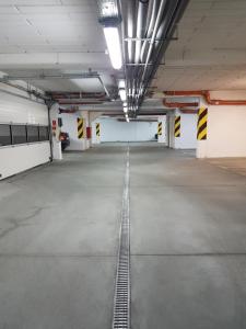 an empty parking lot in a parking garage at SleepWell in Zielona Góra