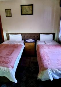 Postel nebo postele na pokoji v ubytování Guest House Marketti
