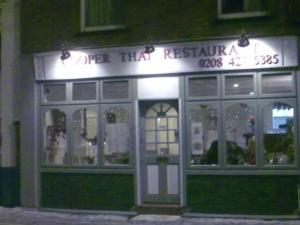 a store front of a restaurant at night at Archery Close in Harrow Weald