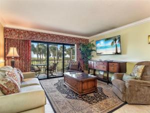 a living room with a couch and a table at South Seas Beach Villa 2313 in Captiva