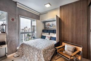 Krevet ili kreveti u jedinici u objektu Homelike Faria Lima by Okaeri Home Vista Incrível, Piscina e Estacionamento em Pinheiros