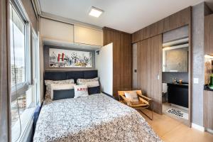 Krevet ili kreveti u jedinici u objektu Homelike Faria Lima by Okaeri Home Vista Incrível, Piscina e Estacionamento em Pinheiros