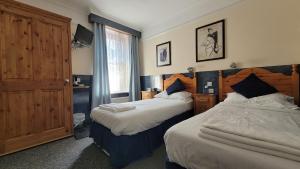 Llit o llits en una habitació de Argyle Lodge