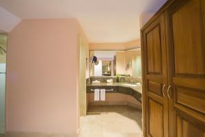 
a kitchen with a sink and a door at Fiesta Americana Puerto Vallarta All Inclusive & Spa in Puerto Vallarta

