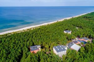 an aerial view of a house and the beach at Millennium Health Resort & Spa in Międzywodzie