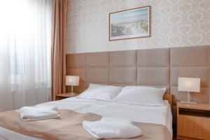 Posteľ alebo postele v izbe v ubytovaní Millennium Health Resort & Spa