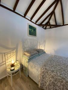 En eller flere senge i et værelse på Casita La Rosa