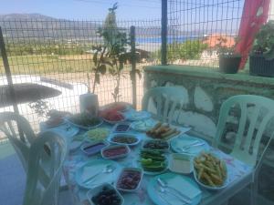 a table with plates of food on it at Kaplan Apart - Pansiyon in Yeşilova