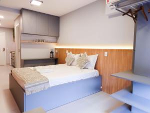Säng eller sängar i ett rum på Haus Stay Luxo Vila Mariana