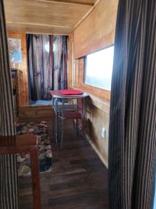 a dining room with a table in a tiny house at La loma del chivo Llc Stone Cottage alternative building in Marathon +17 photos