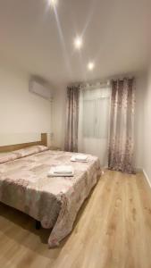 Posteľ alebo postele v izbe v ubytovaní Apartsalou Tati
