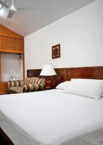 Postel nebo postele na pokoji v ubytování Hotel CALLI YOLOTL Teotihuacan