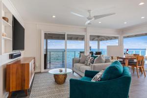 a living room with a view of the ocean at Turtle Rock in Kailua-Kona