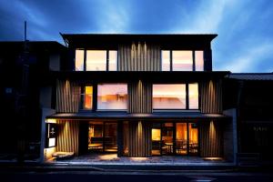 a tall building with many windows on top of it at Kikokutei Bekkan in Kyoto