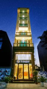 a tall building with a store in front of it at HOTEL TE AMO in Hai Phong