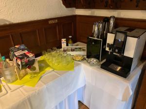 a kitchen counter with a blender and some food at Hotel Goldene Krone in Goslar