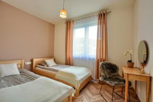 Postel nebo postele na pokoji v ubytování Apartament Boho