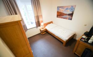 Postel nebo postele na pokoji v ubytování Hotel Waldhalle + 37 fotografií