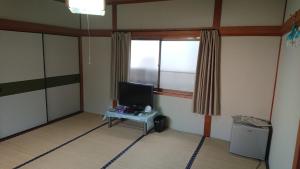 TV a/nebo společenská místnost v ubytování Guesthouse Kumano