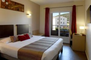 Postel nebo postele na pokoji v ubytování Hôtel A Madonetta