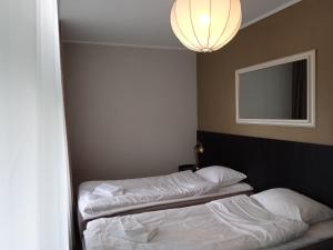 Postel nebo postele na pokoji v ubytování Hotel Marino