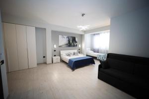 Llit o llits en una habitació de IsolaDino b&b sweet home