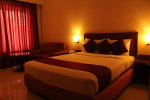 Postel nebo postele na pokoji v ubytování President Hotel