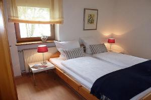 Säng eller sängar i ett rum på Ferienwohnung Brüssing