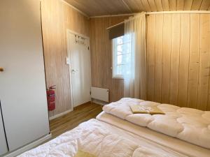 Postel nebo postele na pokoji v ubytování Vennebo - Koselig liten hytte med alle fasiliteter