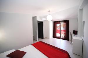 Llit o llits en una habitació de IsolaDino b&b sweet home