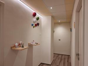 a hallway with balloons hanging on a wall at RosAmar in Bari