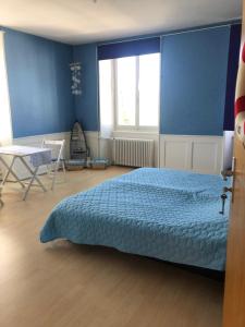 Postel nebo postele na pokoji v ubytování Chambres d'Hotes Le Passiflore