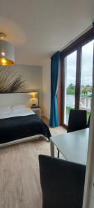 Postel nebo postele na pokoji v ubytování Hotel La Cascada
