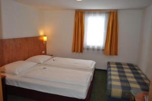 Posteľ alebo postele v izbe v ubytovaní Hotel Tauernpasshöhe