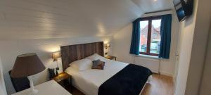 Postel nebo postele na pokoji v ubytování Hotel La Cascada